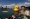 黄色小鸭相隔10年重返香港维多利亚港展出，不料才半天，就有一只小鸭泄气，平瘫漂浮在海面上。-路透社-