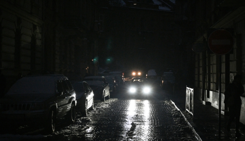 Cars drive on a dark highway in Lviv after the recent massive Russian airstrikes on Ukraine's energy infrastructure during the Russian invasion of Ukraine.  AFP. 