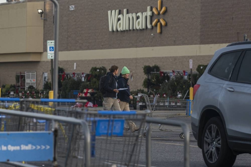 FBI members investigate Tuesday's shooting at the Chesapeake Walmart Supercenter in Chesapeake, Virginia, Nov. 24, 2022. Six people, including the suspect, were killed in Tuesday night's shooting. 