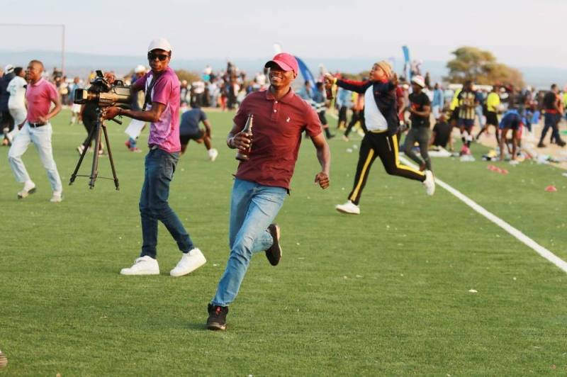 UNLAWFUL...Pitch invasion during the recent Debswana National First Division final play offs game between VTM FC and Chadibe North FC at the Arena.