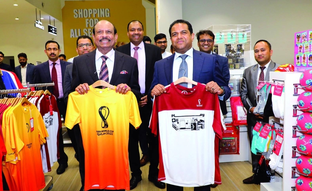 LuLu Group chairman Yusufali M A and Dr Mohamed Althaf, director, LuLu Group International, show off some of the official FIFA World Cup merchandise available at Barwa Madinatna.