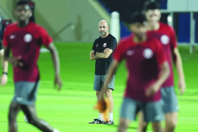 Qatar’s Spanish coach Felix Sanchez leads a training session at the Aspire Academy training pitch in Doha yesterday. (AFP)
