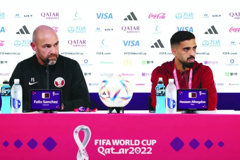 Qatar's Spanish coach Felix Sanchez (L) and Qatar's forward Hassan Al-Haydos attend a press conference at the Qatar National Convention Center (QNCC) in Doha on November 19, 2022 on the eve of the Qatar 2022 World Cup football match between Qatar and Ecuador. (Photo by KARIM JAAFAR / AFP)