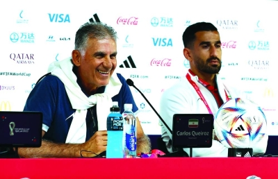 Iran coach Carlos Queiroz and Ehsan Hajisafi during a press conference in Doha. (Reuters) 