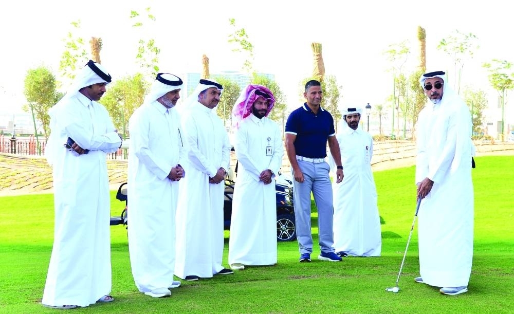 HE the Minister of Sports and Youth Salah bin Ghanem bin Nasser al-Ali preparing to putt during the inauguration of Corinthia Golf Club held yesterday at Gewan Island; looking on are UDC chairman Turki bin Mohamed al-Khater, UDC president and CEO and member of the board Ibrahim Jassim al-Othman, and other dignitaries. PICTURES: Shaji Kayamkulam.
