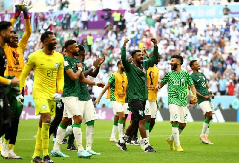 Saudi Arabia players celebrate after celebrate outside the stadium after the national teams win against Argentina in the FIFA World Cup Qatar 2022 Group C match Monday at Lusail Stadium. REUTERS