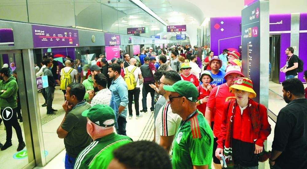 Football fans from various countries at a Doha Metro station.