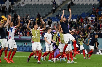 France players celebrate at the end of the Qatar 2022 World Cup Group D football match between France and Australia at the Al-Janoub Stadium in Al-Wakrah, south of Doha Tuesday. AFP