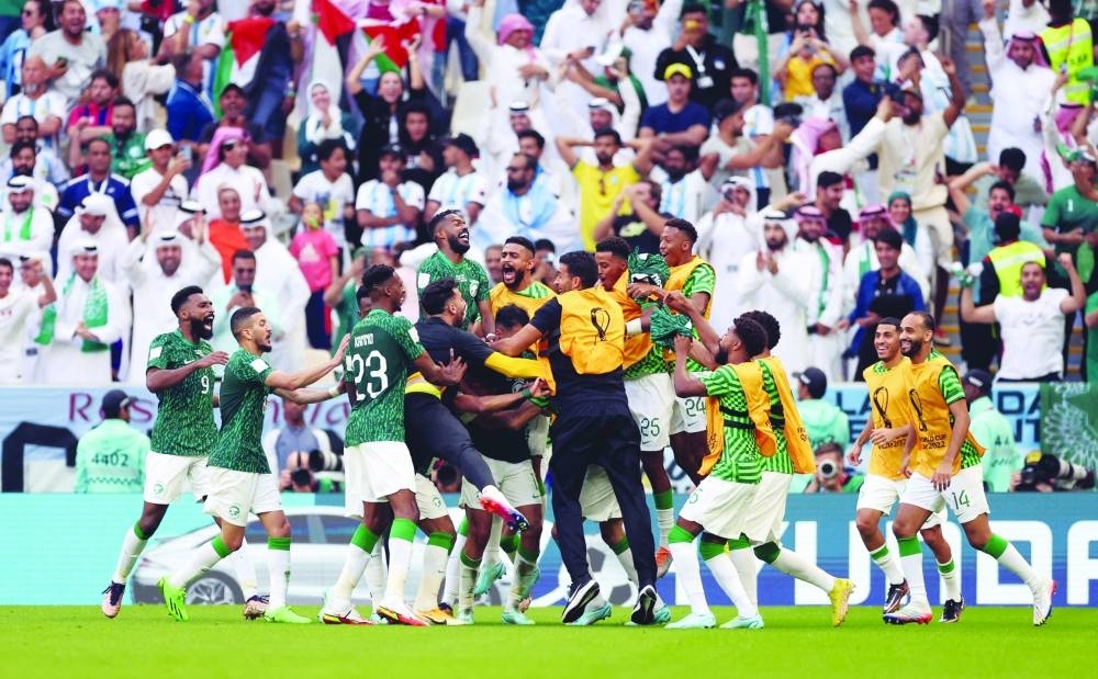 Saudi Arabia&#039;s Salem al-Dawsari celebrates scoring their second goal with teammates (REUTERS)