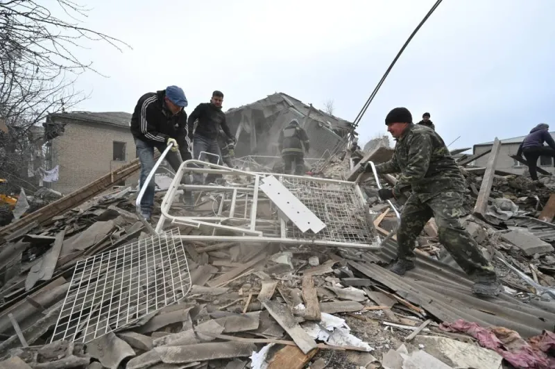 Rescuers work at the site of a maternity ward of a hospital destroyed by a Russian missile attack. (Reuters)