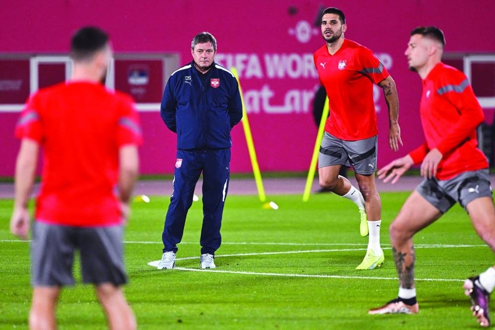 Serbia’s coach Dragan Stojkovic leads a training session of his team at the Al Arabi Stadium in Doha yesterday, on the eve of their Qatar 2022 World Cup match against Brazil. (AFP)