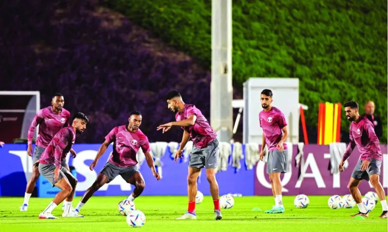 Qatar's players take part in a training session at Aspire Training Site in Doha on November 24, 2022, on the eve of the Qatar 2022 World Cup football match between Qatar and Senegal. (Photo by KARIM JAAFAR / AFP)