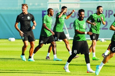 Saudi Arabia’s French coach Herve Renard (left) heads a training session at the Sealine Training site in Doha, yesterday, on the eve of the Qatar 2022 World Cup match against Poland. (AFP)