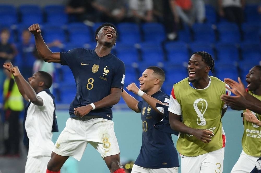 France&#039;s midfielder Aurelien Tchouameni, France&#039;s forward Kylian Mbappe and France&#039;s defender Axel Disasi celebrate at the end of the Qatar 2022 World Cup Group D football match between France and Denmark at Stadium 974 in Doha. REUTERS