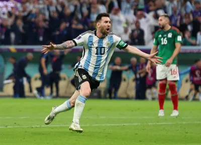 Argentina’s Lionel Messi celebrates scoring their first goal against Mexico during the FIFA World Cup Qatar 2022 Group C match at the Lusail Stadium yesterday. (Reuters)