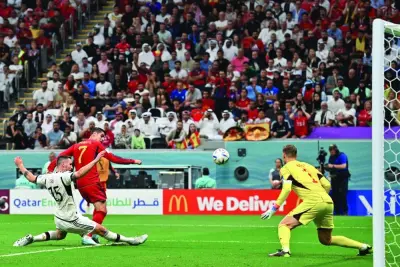 Spain's forward Alvaro Morata scores his team's opening goal during the Qatar 2022 World Cup Group E match against Germany at the Al Bayt Stadium yesterday. (AFP)