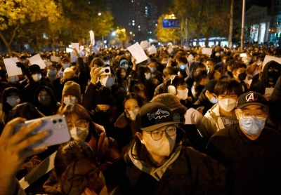 Protesters march along a street during a rally in China. (AFP)