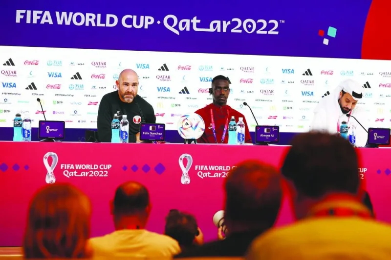 Qatar’s Almoez Ali and coach Felix Sanchez (left) during the press conference at the Qatar National Convention Centre in Doha yesterday. (Reuters)