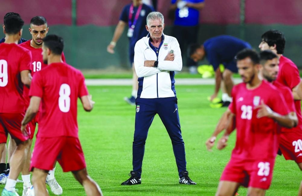 Iran's Portuguese coach Carlos Queiroz heads a training session at Al Rayyan SC in the Al Rayyan district in Doha, yesterday.