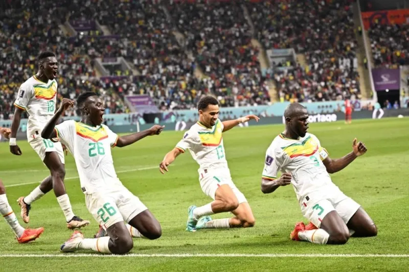 Senegal&#039;s defender Kalidou Koulibaly (R) celebrates scoring his team&#039;s second goal during the Group A match between Ecuador and Senegal at the Khalifa International Stadium in Doha