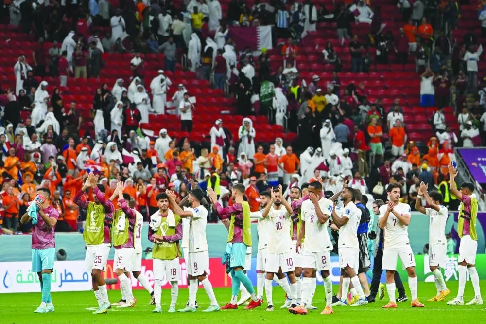 Qatar players applaud the fans after the Qatar 2022 World Cup Group A match against the Netherlands at the Al Bayt Stadium in Al Khor, north of Doha, yesterday. (AFP)