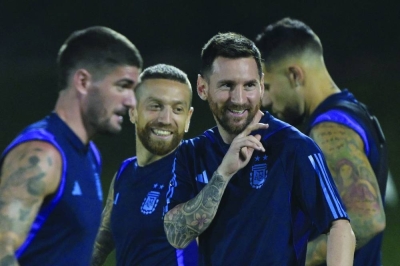 Argentina’s Lionel Messi (second right) gestures next to teammates during a training session at the Qatar University in Doha yesterday, on the eve of the World Cup Group C match against Poland. (AFP)
