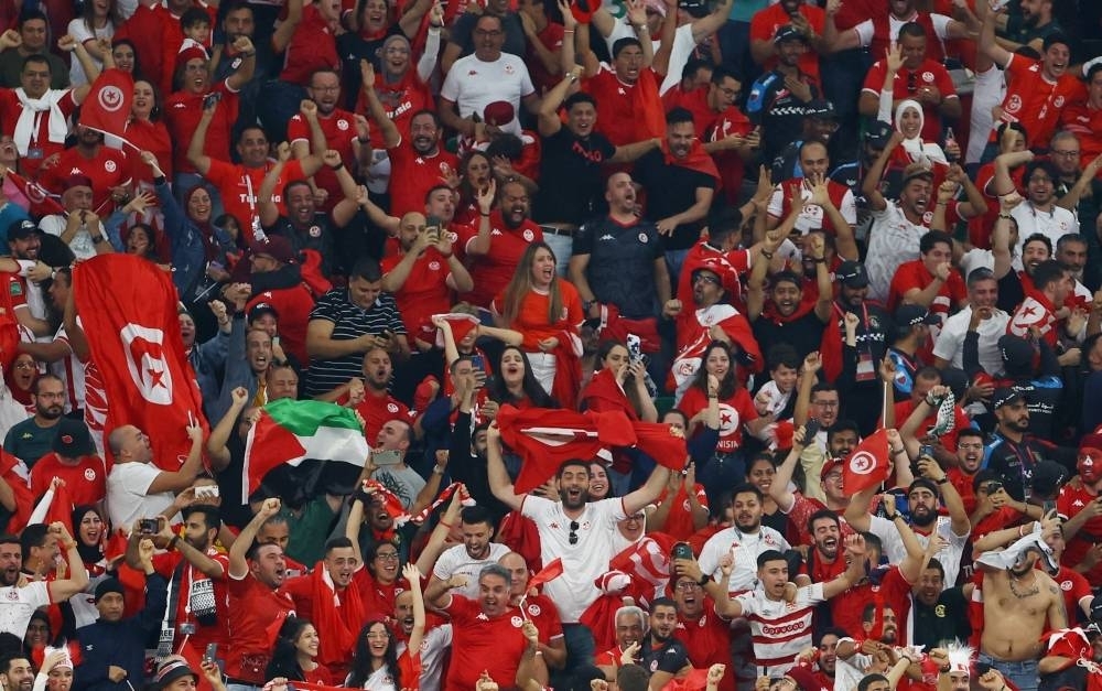 Tunisia fans celebrate their team&#039;s goal at Education City Stadium, Doha.
