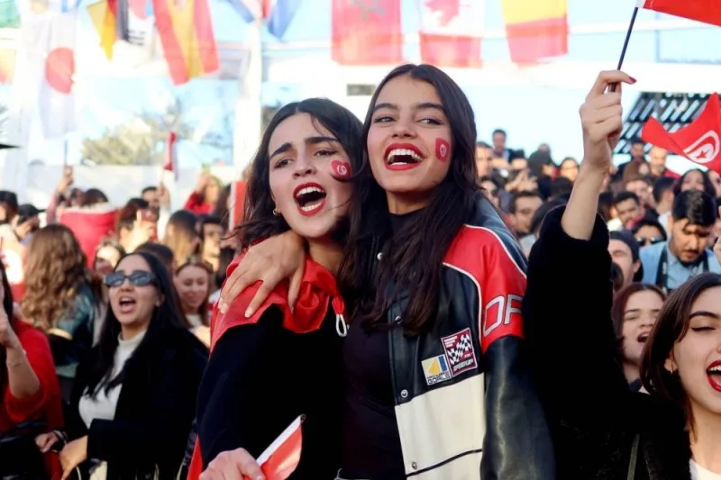 Tunisia fans celebrate during the match at the fan zone in Tunis.