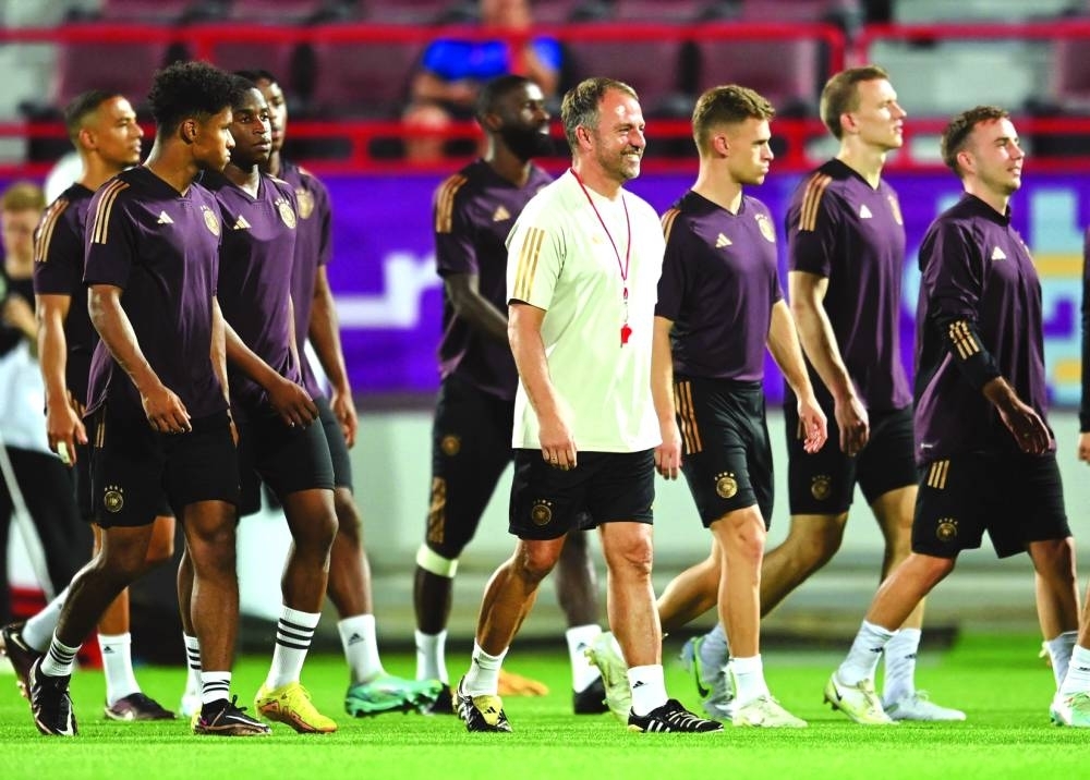 Germany coach Hansi Flick (centre) with his players during a training session at Al Shamal Stadium. (Reuters)