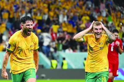 Australia’s forward Mathew Leckie (left) celebrates scoring his team’s first goal beside teammate midfielder Riley McGree during the Qatar 2022 World Cup Group D match against Denmark at the Al Janoub Stadium in Al Wakrah yesterday.