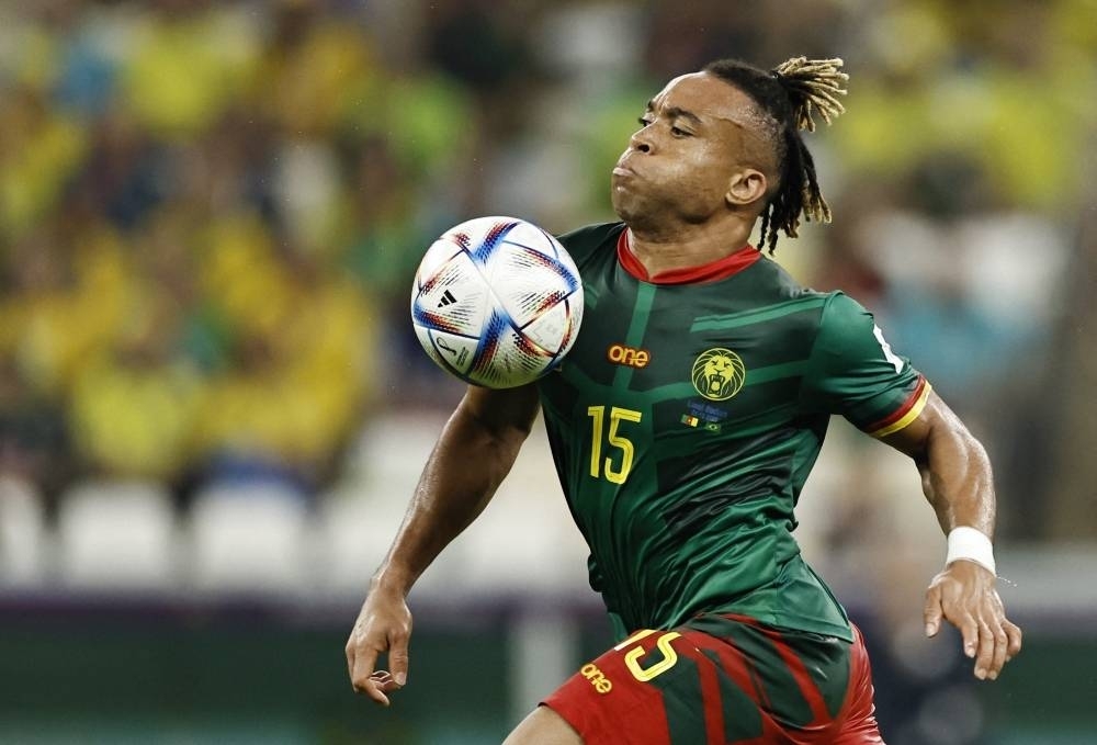 Cameroon&#039;s Pierre Kunde in action against Brazil. REUTERS