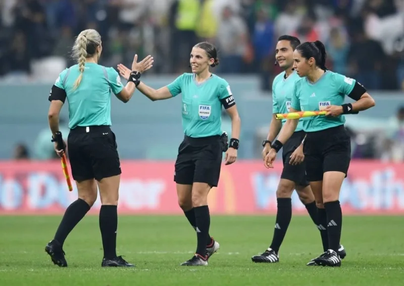 Referee Stephanie Frappart, assistant referees Neuza Back and Karen Diaz and fourth official Said Martinez react after the Costa Rica v Germany match at Al Bayt Stadium.
