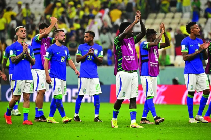 Brazil players applaud the fans on the pitch after the match against Cameroon at the Lusail Stadium in Lusail, on Friday. Brazil have not yet faced top opposition and will expect to cruise past South Korea tomorrow. (AFP)