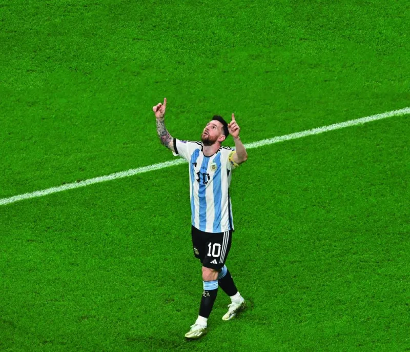 Argentina's forward #10 Lionel Messi celebrates scoring his team's first goal during the Qatar 2022 World Cup round of 16 football match between Argentina and Australia at the Ahmad Bin Ali Stadium in Al-Rayyan, west of Doha on December 3, 2022. (Photo by Glyn KIRK / AFP)