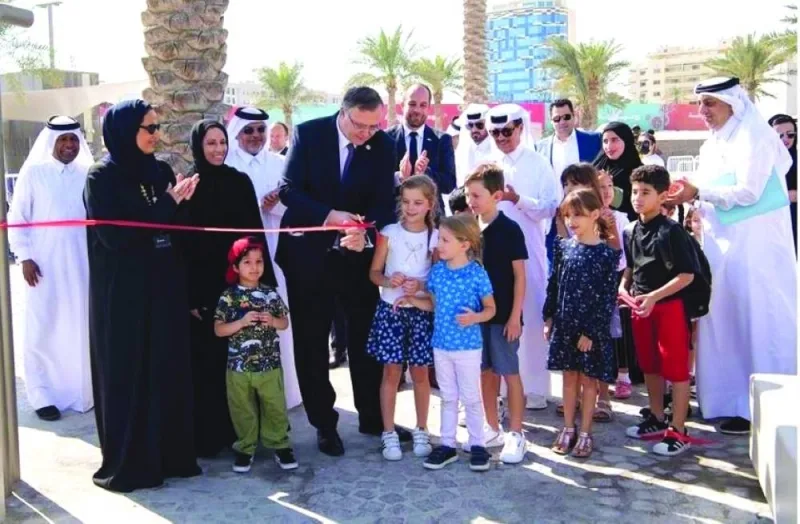 HE Sheikha Al Mayassa bint Hamad al-Thani and Patrick Pouyanne with other officials and children at the inauguration of the TotalEnergies Playground. Supplied picture