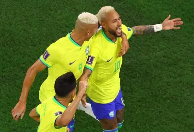 Brazil&#039;s Neymar celebrates scoring with Richarlison and Lucas Paqueta