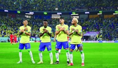 From right: Brazil’s Neymar, Lucas Paqueta, Vinicius Junior and Raphinha celebrate after their win over South Korea in the Qatar 2022 World Cup Round of 16 match at Stadium 974 yesterday. (Reuters)