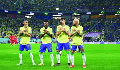 From right: Brazil’s Neymar, Lucas Paqueta, Vinicius Junior and Raphinha celebrate after their win over South Korea in the Qatar 2022 World Cup Round of 16 match at Stadium 974 yesterday. (Reuters)