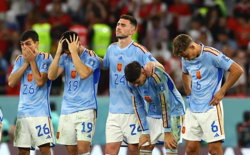 Spain players react after Sergio Busquets misses a penalty during a shootout in the match against Morocco at the Education City Stadium in Al-Rayyan in Doha Tuesday.