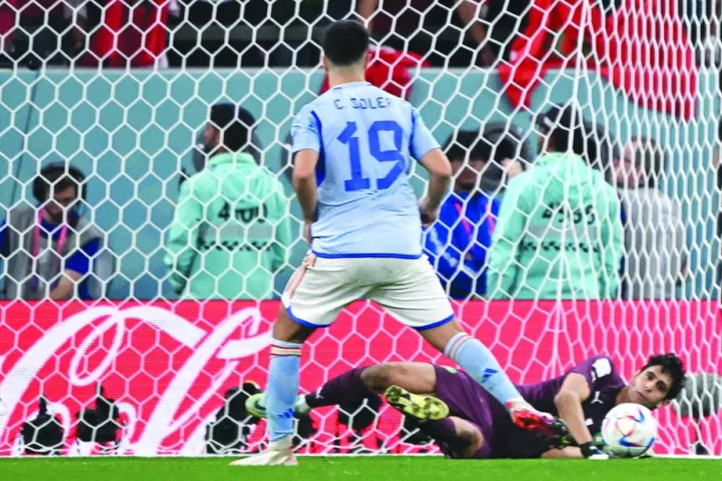 Morocco’s goalkeeper Yassine Bounou deflects penalty kicks from Spain’s Carlos Soler yesterday. (AFP)