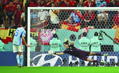 Morocco’s goalkeeper Yassine Bounou deflects penalty kicks from Spain’s Sergio Busquets yesterday. (AFP)