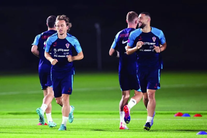 Croatia’s midfielder Luka Modric (left) joins teammates in a training session at the Al Erssal training site in Doha, yesterday. (AFP)