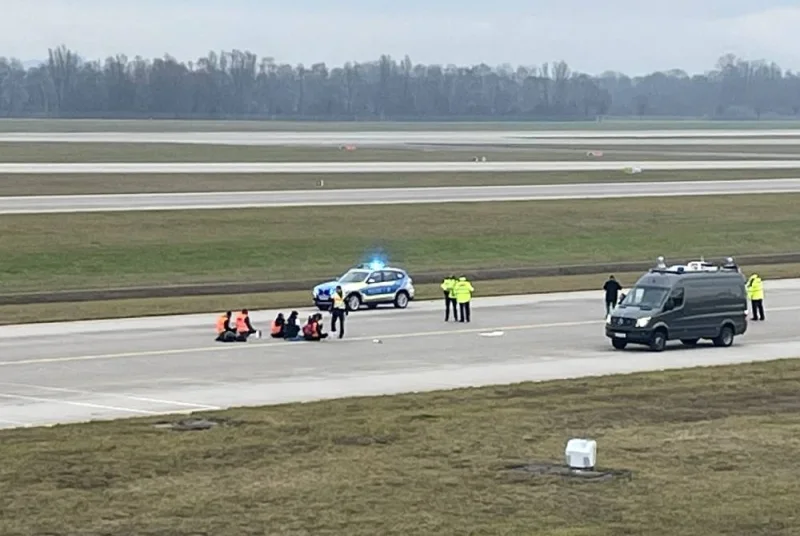 Activists of "Letzte Generation" (Last Generation) glued themselves to the tarmac of the airport to protest (REUTERS)