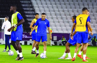 France’s Kylian Mbappe (centre) and teammates during training at the Al Sadd SC Stadium, Doha, yesterday. (Reuters)