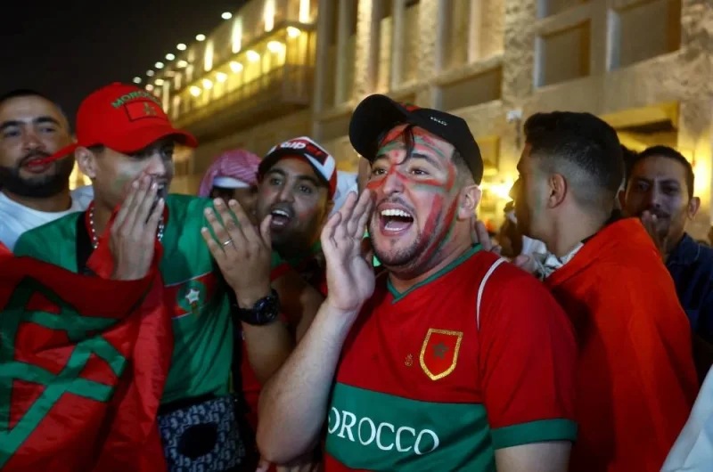 Morocco fans in Souq Waqif, celebrate as Morocco progress to the semi finals after the Morocco and Portugal match. REUTERS