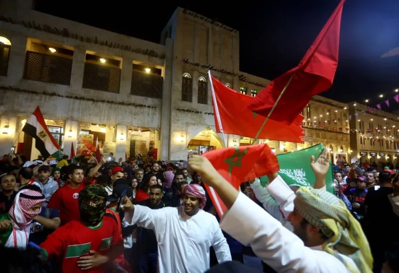 Morocco fans in Souq Waqif, celebrate as Morocco progress to the semi finals after the Morocco and Portugal match. REUTERS