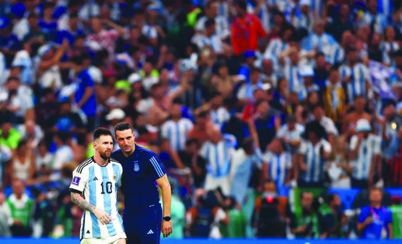 Captain Lionel Messi and coach Lionel Scaloni celebrate as Argentina progress to the semi-finals of the FIFA World Cup Qatar 2022. (Reutrers)