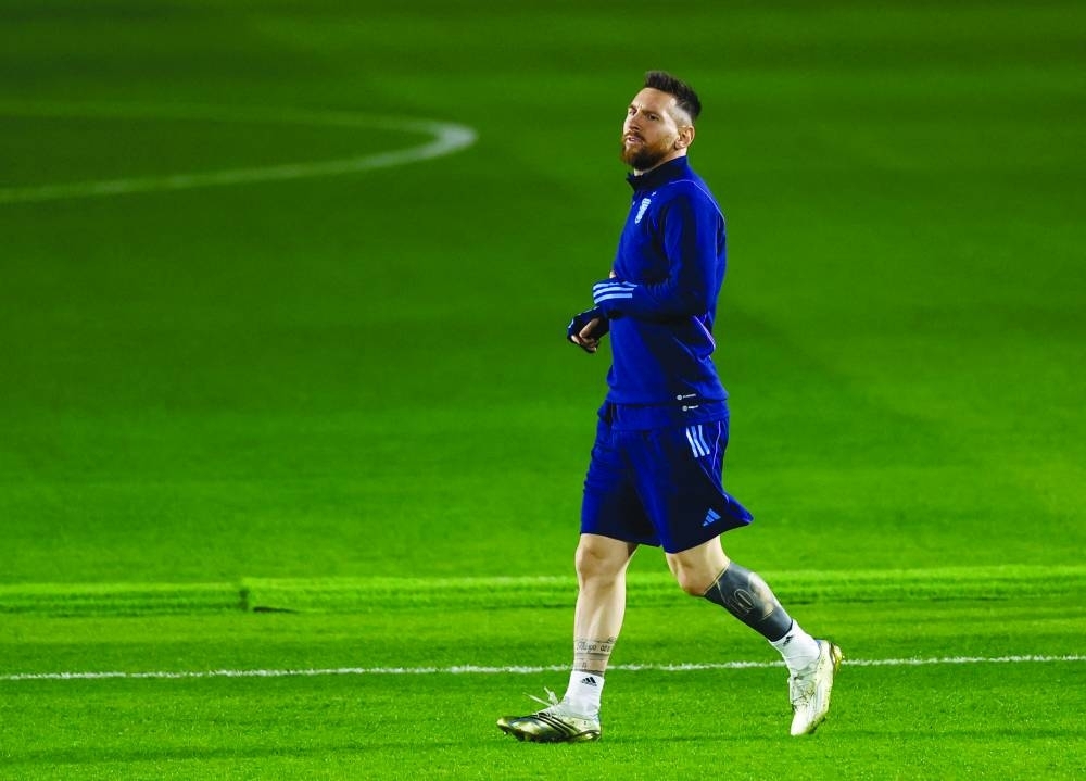 Argentina’s forward Lionel Messi takes part in a training session at Qatar University in Doha on the eve of the Qatar 2022 World Cup semi-final against Croatia. (Reuters)