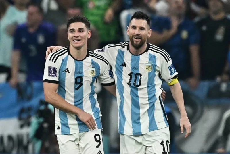 Argentina&#039;s Julian Alvarez celebrates scoring the third goal with Lionel Messi.