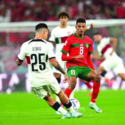 Azzedine Ounahi of Morocco (right) vying for the ball with Portugal’s Otavio during their FIFA World Cup Qatar 2022 quarter-final at Al Thumama Stadium in Doha on December 10, 2022. Morocco won 1-0 to reach the semi-final. Picture: Twitter/@EnMaroc